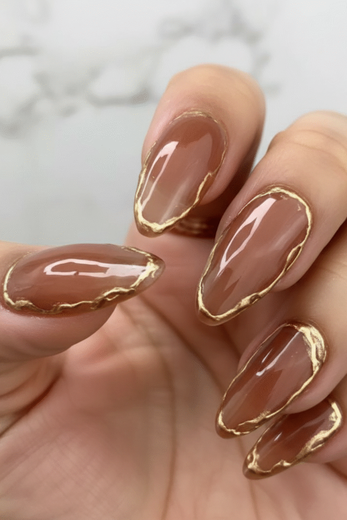 π
Channel Your Inner Goddess With This Opulent Nail Trend 3 Greek Goddess almond nails with a sheer neutral base and bold gold leaf accents placed along the cuticle. Classic Quiet Luxury look.