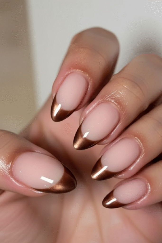 Fall French manicure with olive, burnt orange, and brown tips in almond and square shapes
