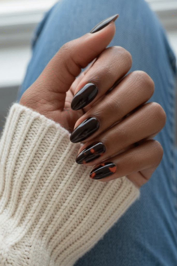 Tortoiseshell nails in amber, caramel, and dark espresso tones with glossy finish
